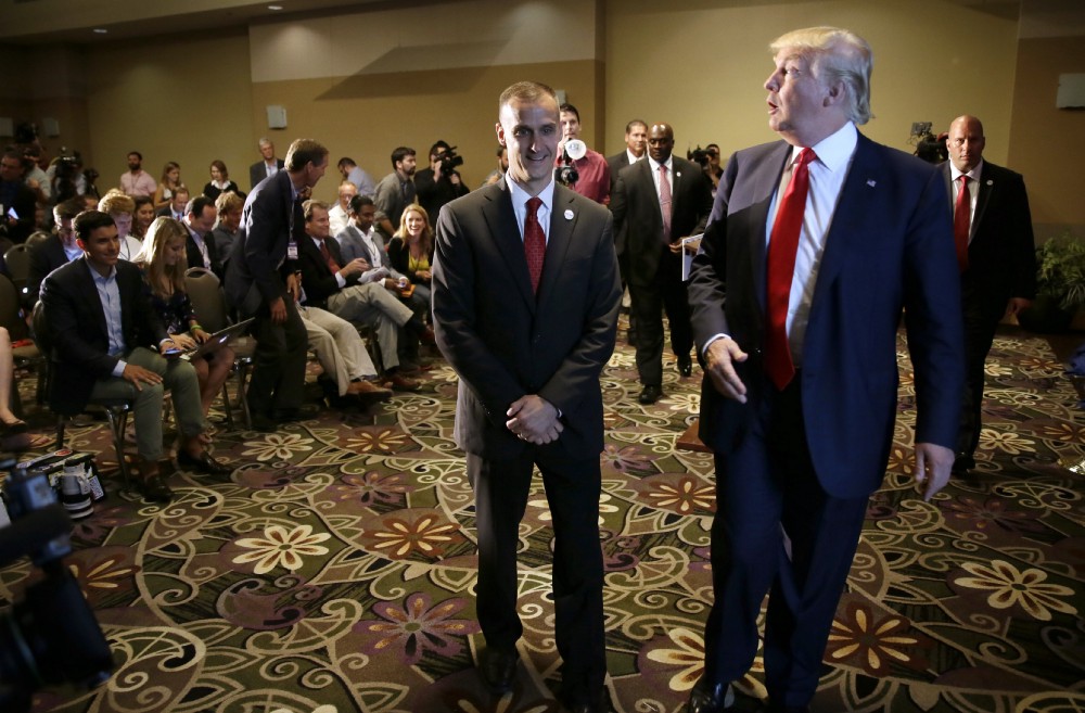 Corey Lewandowski and Donald Trump at a 2015 campaign event. CREDIT: AP Photo/Charlie Neibergall