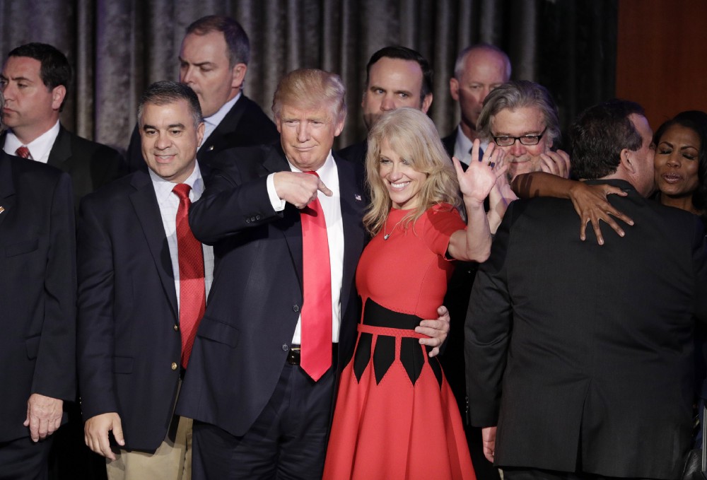 Donald Trump and campaign manager Kellyanne Conway celebrate during an election night rally. CREDIT: AP Photo/John Locher