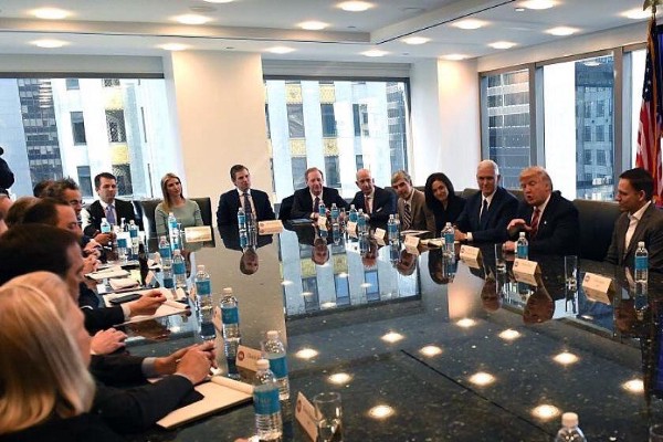 Ivanka Trump with the Japanese Prime Minister (left), Ivanka, Eric and Donald Trump Jr. with tech leaders (right) CREDIT: Trump transition handout, Screengrab