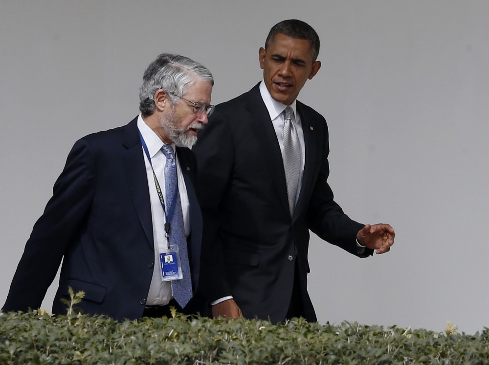 President Barack Obama and Dr. John Holdren at the White House in 2014. CREDIT: AP Photo/Charles Dharapak