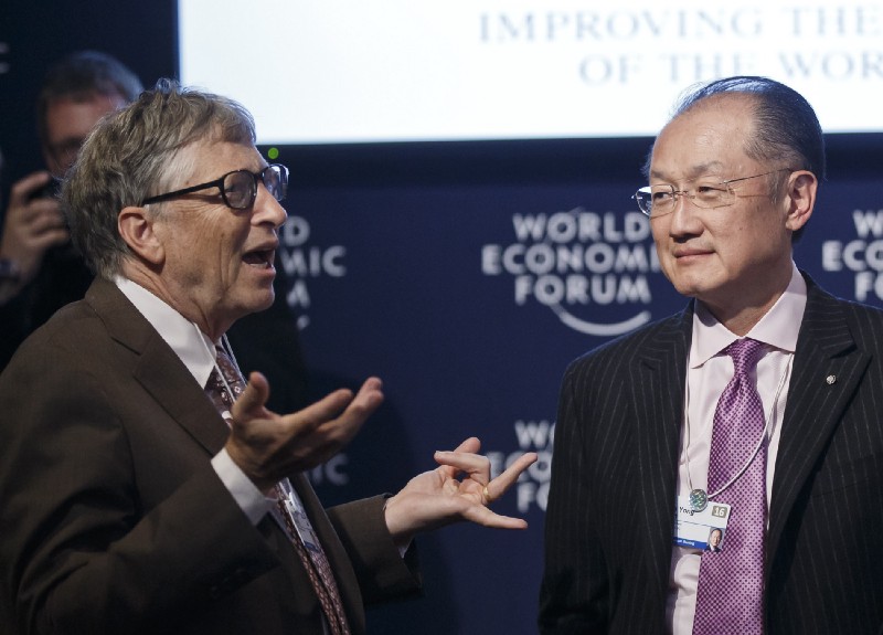 Billionaire Bill Gates and World Bank head Jim Yong Kim at the 2016 edition of the hyper-elite World Economic Forum in Davos, Switzerland. CREDIT: AP Photo/Michel Euler