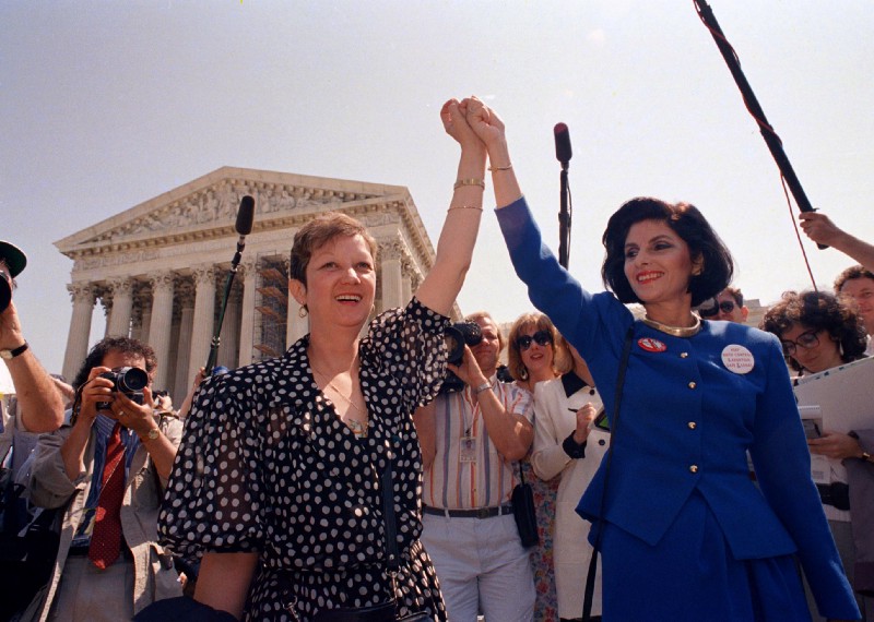 Norma McCorvey and her attorney Gloria Allred leave the Supreme Court building in Washington, DC., April 26, 1989 after sitting in while the court listened to arguments in a Missouri abortion case. CREDIT: AP Photo/J. Scott Applewhit)