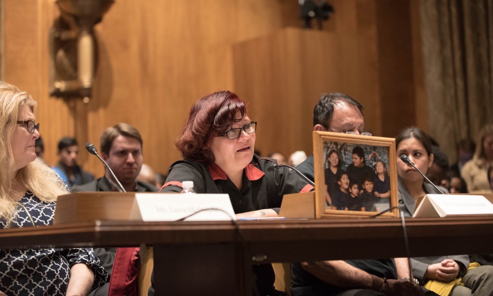 Lupe Guzman (center) speaks before Congress about her experiences at a Carl’s Jr. restaurant in Las Vegas. CREDIT: Sen. Warren and Sen. Stabenow’s offices