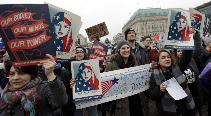 Protesters attend a ‘Berlin Women’s March on Washington’ demonstration in front of the Brandenburg Gate in Berlin, Germany, Saturday, Jan. 21, 2017. CREDIT: AP Photo/Michael Sohn
