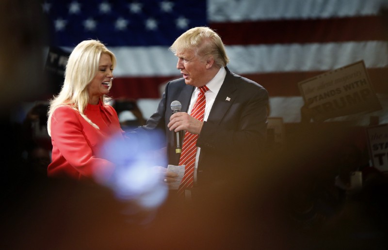 Donald Trump is greeted by Florida Attorney General Pam Bondi as she introduces him to speak at a campaign event in Tampa, Fla., Monday, March 14, 2016. CREDIT: AP Photo/Gerald Herbert