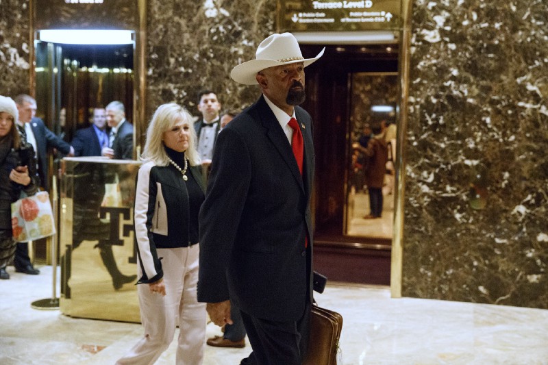 Milwaukee Sheriff David Clarke leaves Trump Tower. CREDIT: AP Photo/ Evan Vucci