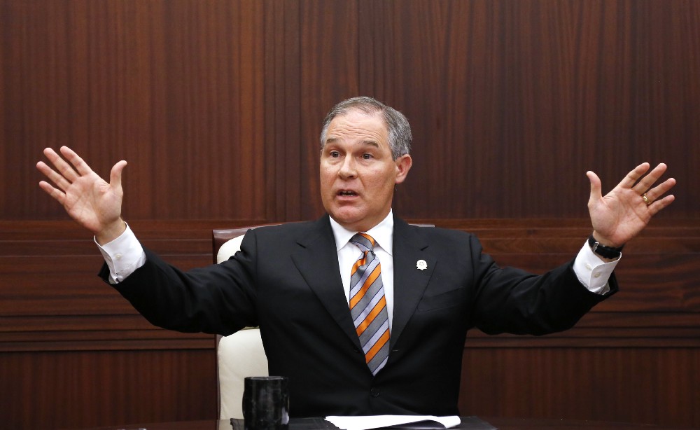 Oklahoma Attorney General Scott Pruitt gestures as he answers a question during a news conference in Oklahoma City. CREDIT: AP Photo/Sue Ogrocki, File