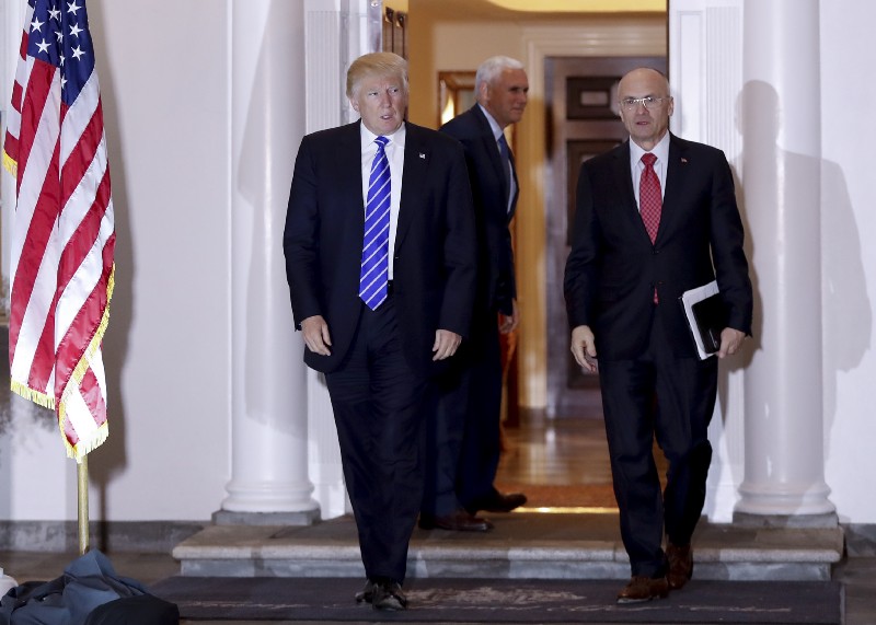 President-elect Donald Trump and Andy Puzder, chief executive of CKE Restaurants, walk from Trump National Golf Club Bedminster clubhouse in Bedminster, N.J., Saturday, Nov. 19, 2016. CREDIT: AP Photo/Carolyn Kaster