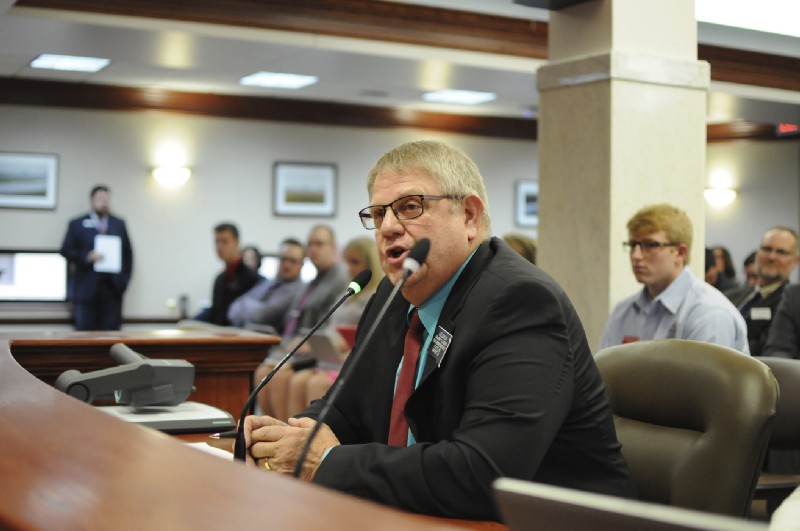 South Dakota House Majority Leader Lee Qualm (R) testifies Monday in support of repealing an ethics reform package. CREDIT: AP Photo/James Nord