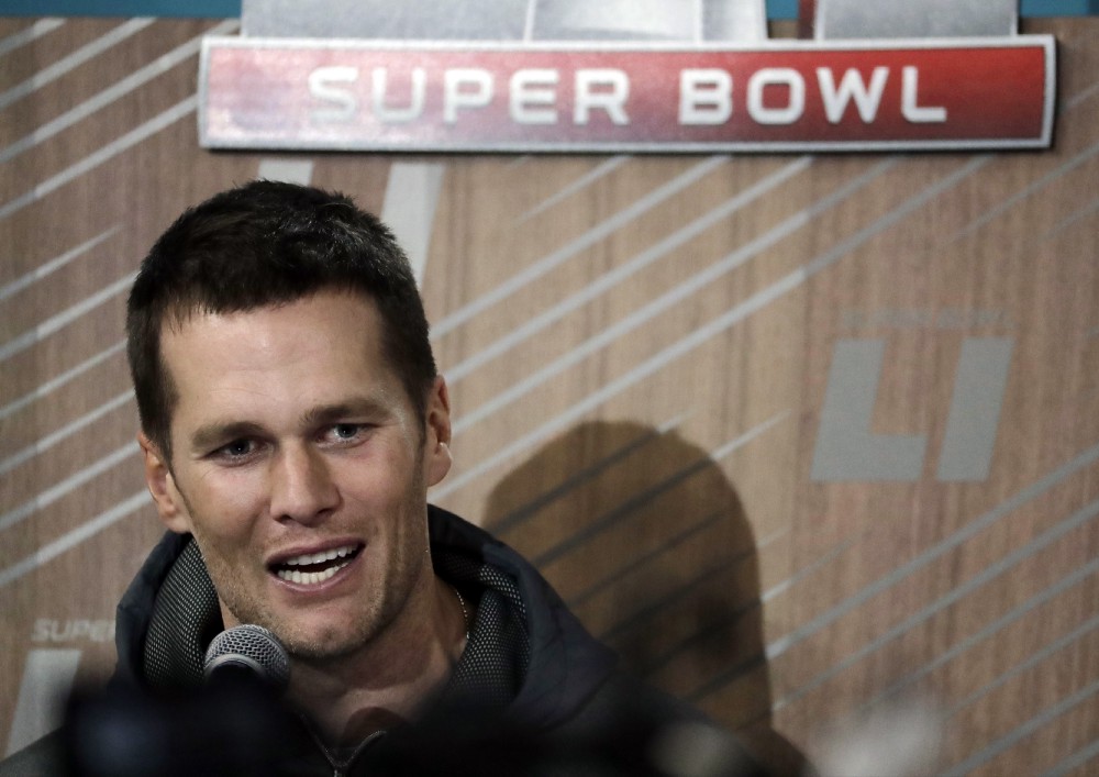 New England Patriots’ Tom Brady answers questions during opening night for the NFL Super Bowl 51 football game at Minute Maid Park Monday, Jan. 30, 2017, in Houston. CREDIT: AP Photo/Charlie Riedel