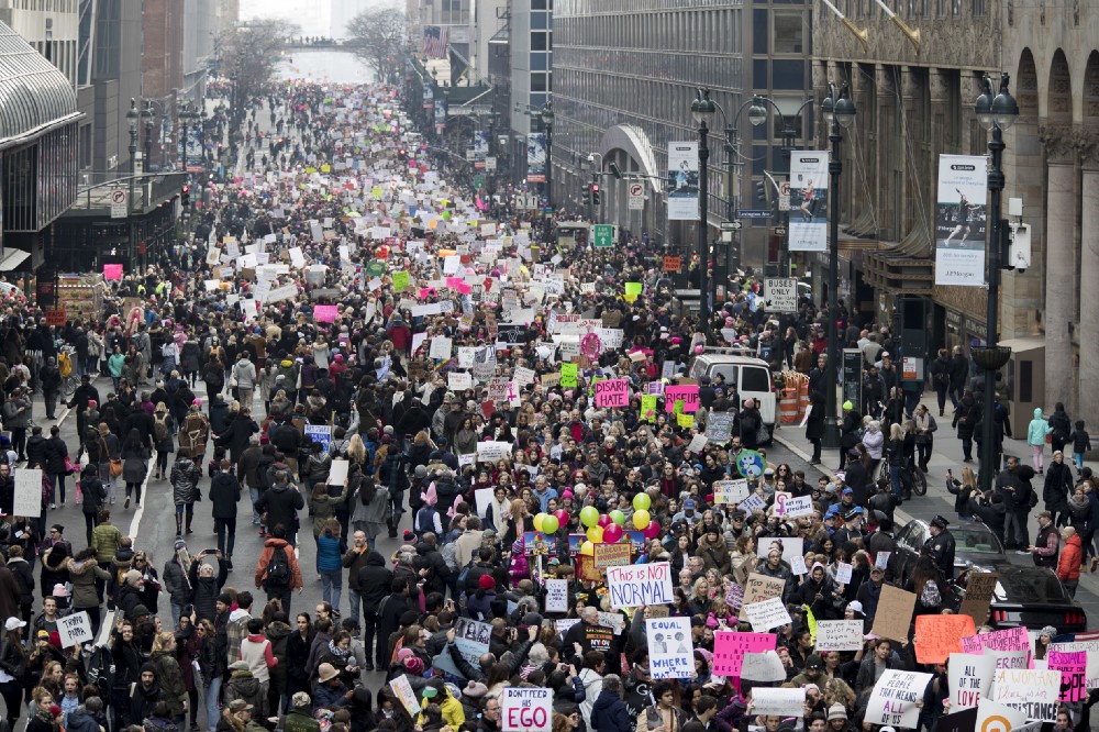 Demonstrators march across 42nd Street during a women’s march, Saturday, Jan. 21, 2017, in New York. CREDIT: AP Photo/Mary Altaffer