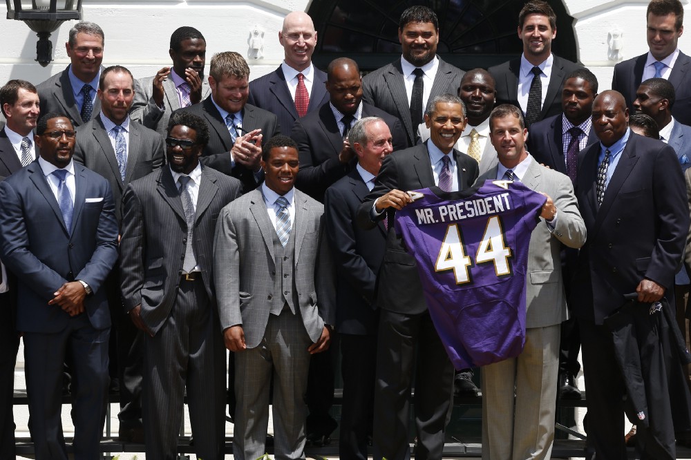President Barack Obama holds a Baltimore Ravens football jersey with head coach John Harbaugh, second from right, during a ceremony on the South Lawn of the White House in Washington, Wednesday, June 5, 2013, where the president honored the Super Bowl XLVII champs. Front row, from left are, retired linebacker Ray Lewis, former safety Ed Reed, running back Ray Rice, team President Richard W. Cass, the president and Harbaugh. CREDIT: AP Photo/Charles Dharapak