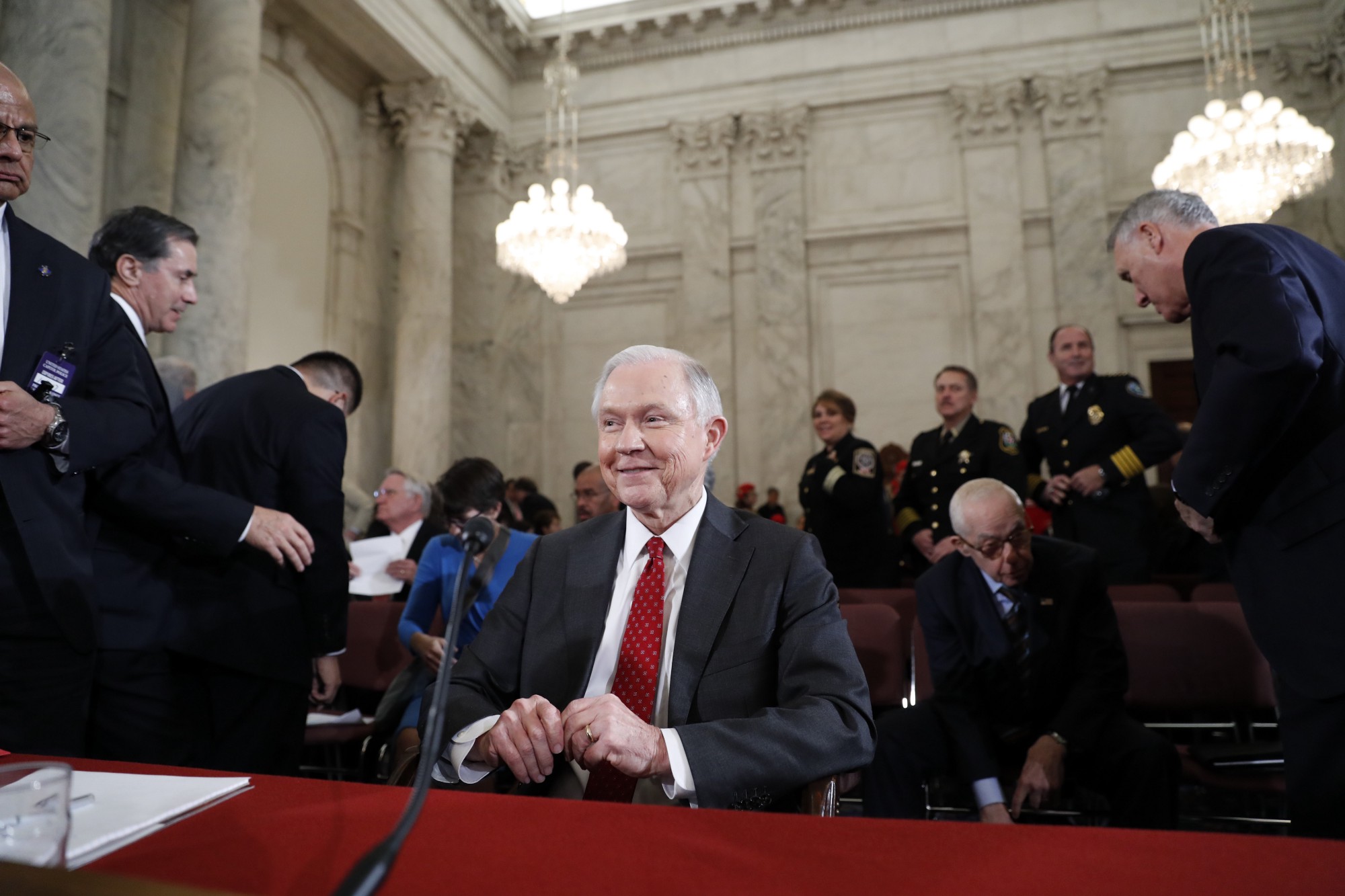 Police officers look on as Sen. Jeff Sessions (R-AL) prepares to testify before the Senate Judiciary Committee on his nomination for Attorney General. CREDIT: AP Photo/Alex Brandon