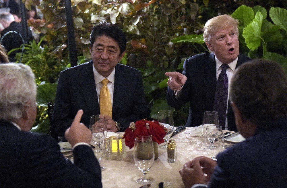 President Donald Trump sits down to dinner with Japanese Prime Minister Shinzo Abe at Mar-a-Lago on Friday. CREDIT: AP Photo/Susan Walsh