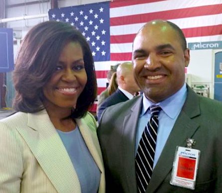 Johnson with Michelle Obama at a White House event where companies committed to train or hire veterans. CREDIT: Kevin Johnson