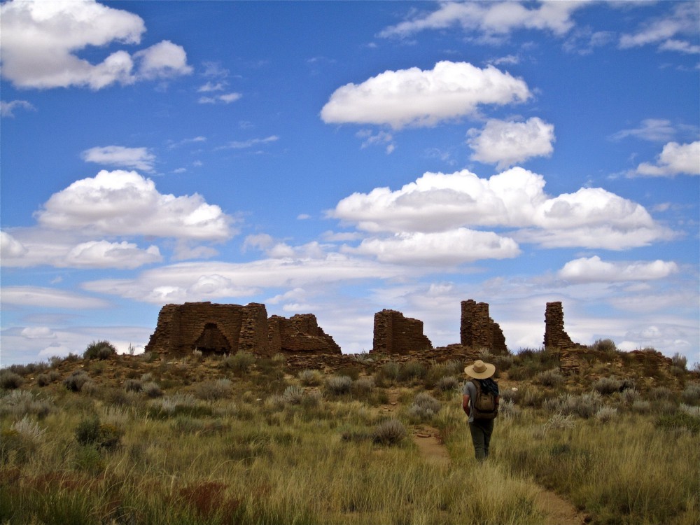 A visitor approaching some of the many ruins that dot Chaco Canyon and the surrounding area. CREDIT: Flickr/donzermeno