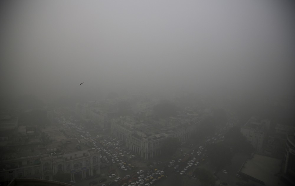 A thick layer of smog covers Connaught Place, the heart of New Delhi, India, Saturday, Nov. 5, 2016. CREDIT: AP Photo/Altaf Qadri