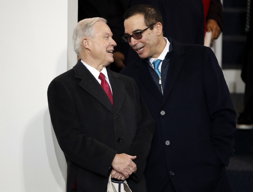 Trump cabinet nominees Jeff Sessions and Steve Mnuchin share a laugh on Inauguration Day. CREDIT: AP Photo/Pablo Martinez Monsivais