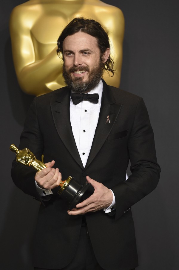 Viola Davis winning Best Supporting Actress and Casey Affleck with his Oscar for Best Actor. CREDIT: Chris Pizzello (left) and Jordan Strauss/AP
