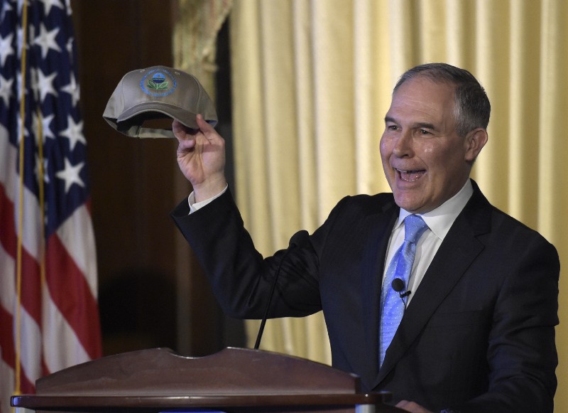 Environmental Protection Agency (EPA) Administrator Scott Pruitt holds up a hat that was presented to him before speaking to employees of the EPA in Washington, Tuesday, Feb. 21, 2017. CREDIT: AP Photo/Susan Walsh