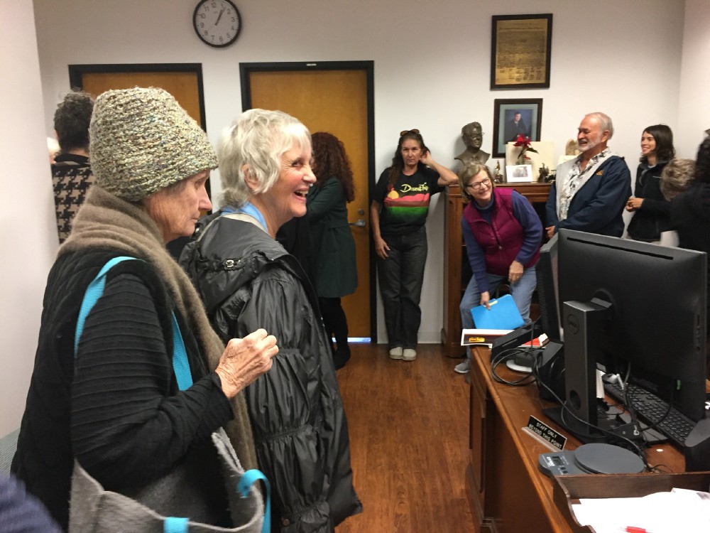 Constituents visiting Rep. Dana Rohrabacher’s district office on January 24th, one week before they were locked out. Kopnick, who was there, said that the staff told the local paper later that they had “barged in chanting.” She says that in reality they tried hard to be respectful, and that she even brought cookies. CREDIT: Kari Kopnick.