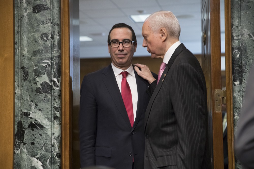 Sen. Orrin Hatch (R-UT) is making sure Treasury Secretary nominee Steve Mnuchin, left, gets special treatment in the Senate. CREDIT: AP Photo/J. Scott Applewhite