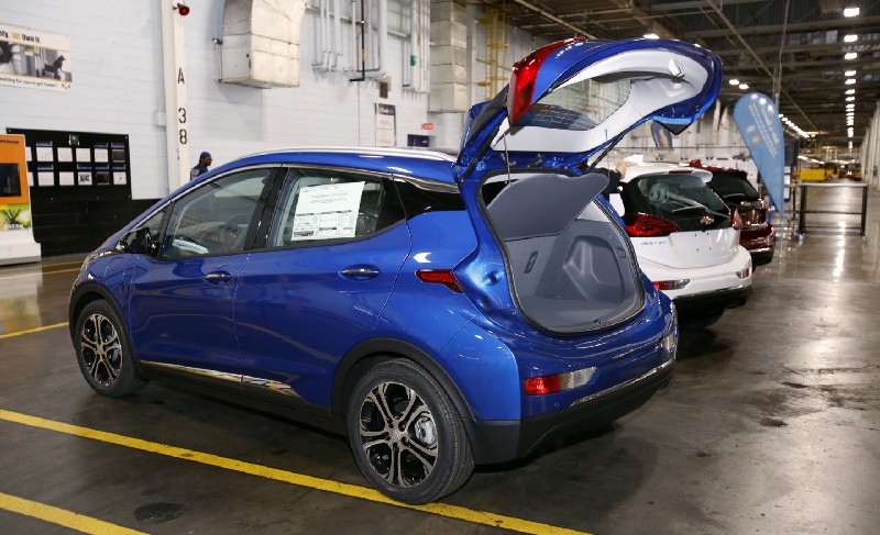 A Chevrolet Bolt EV is on display at the General Motors Orion Assembly plant in Michigan. President Trump’s anti-clean energy policies are expected to set the United States back in the EV race. CREDIT: AP Photo/Duane Burleson)