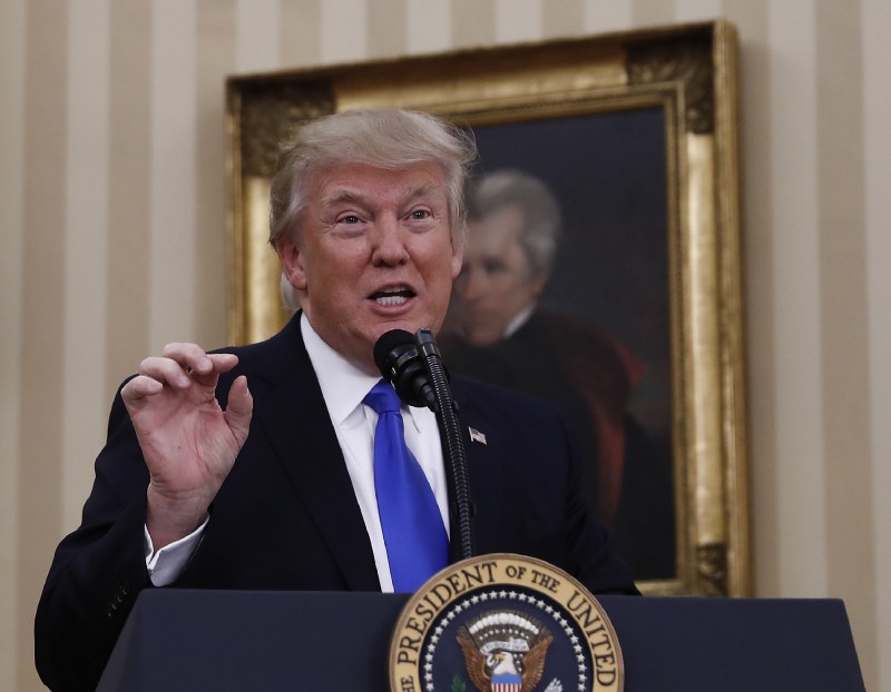 President Donald Trump speaks during a ceremony in the Oval Office of the White House in Washington, Wednesday, Feb. 1, 2017, before Rex Tillerson is sworn in as Secretary of State. CREDIT: AP Photo/Carolyn Kaster