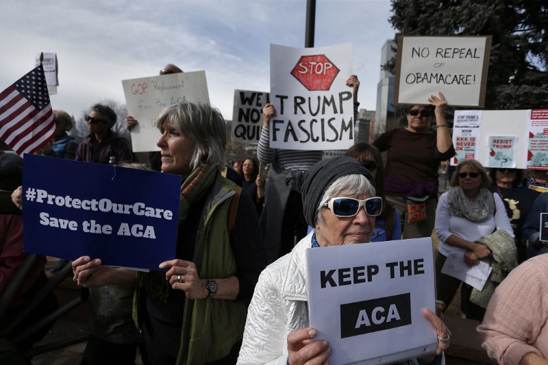 Supporters of the Affordable Care Act gather for a rally organized by the national Save My Care Bus Tour, on the state Capitol steps in Denver, Tuesday, Feb. 7, 2017. CREDIT: AP/ Brennan Linsley