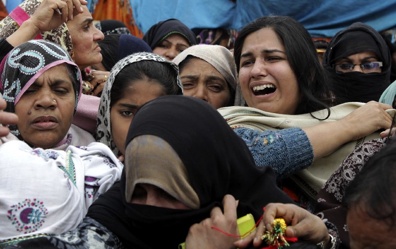Family members and relatives of Monday’s bombing victim, Ali Hassan, mourn his death during a funeral in Lahore, Pakistan, Tuesday, Feb. 14, 2017. CREDIT: AP Photo/K.M. Chaudary