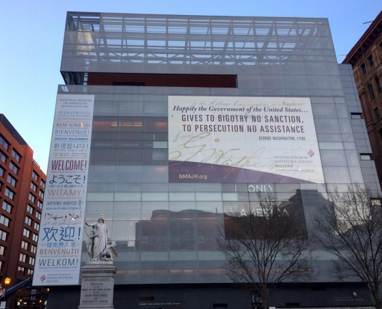 The National Museum of American Jewish History bearing a banner added in December 2016 that quotes George Washington’s letter to the Hebrew Congregation of Newport, Rhode Island in 1790. The original letter is displayed inside the museum. CREDIT: NMAJH
