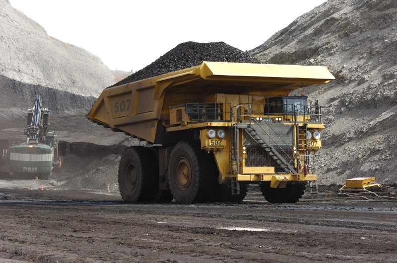 A mining dumper truck hauls coal at Cloud Peak Energy’s Spring Creek strip mine near Decker, Mont. CREDIT: AP Photo/Matthew Brown