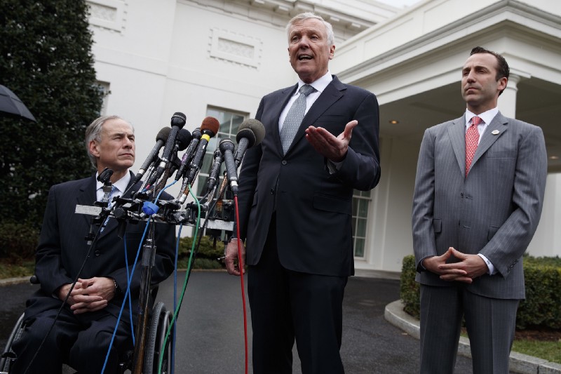 Charter Communications CEO Thomas Rutledge with Texas Gov. Greg Abbott and Reed Cordish, Assistant to the President for Intragovernmental and Technology Initiatives, at the White House on Friday. CREDIT: AP Photo/Evan Vucci