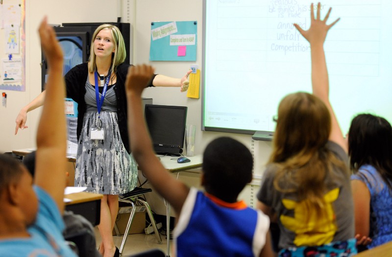 In this Oct. 1, 2013, file photo, Amy Lawson, a fifth-grade teacher at Silver Lake Elementary School in Middletown, Del., teaches an English language arts lesson. CREDIT: AP Photo/Steve Ruark, File