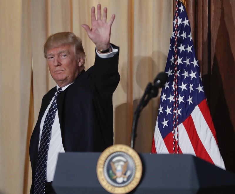 President Donald Trump waves as he walks off stage after signing an Energy Independence Executive Order, Tuesday, March 28, 2017, at EPA headquarters in Washington, Tuesday, March 28, 2017. CREDIT: AP Photo/Pablo Martinez Monsivais
