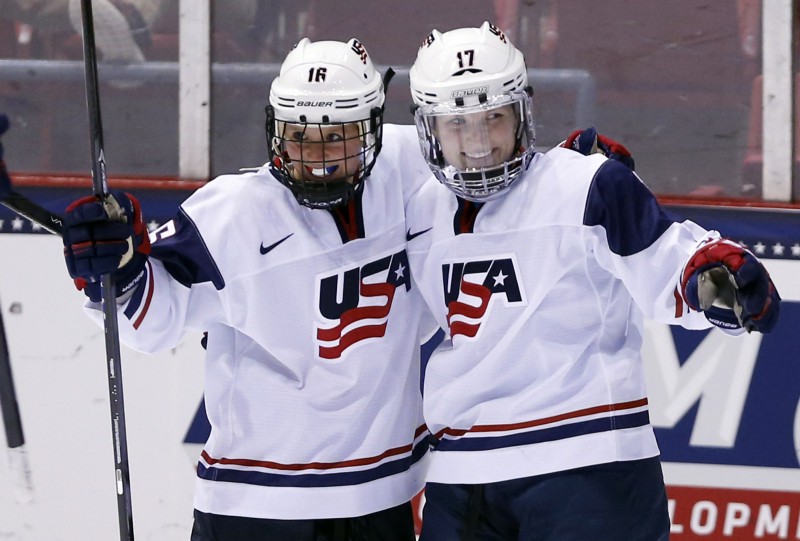 United States’ Jocelyne Lamoureux (17) celebrates her goal against Sweden with teammate Kelli Stack (16) during the second period of a Four Nations Cup women’s third-place hockey game on Saturday, Nov. 9, 2013, in Lake Placid, N.Y. CREDIT: AP Photo/Mike Groll