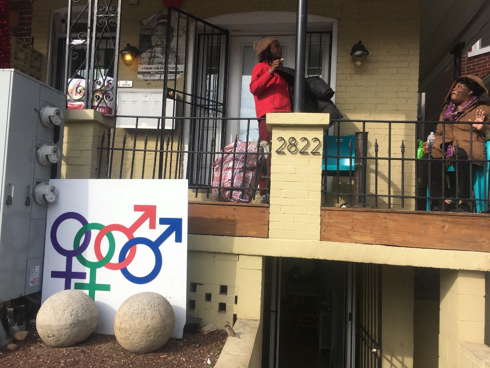 Casa Ruby residents sit on the community center’s porch Monday morning. CREDIT: Kira Lerner
