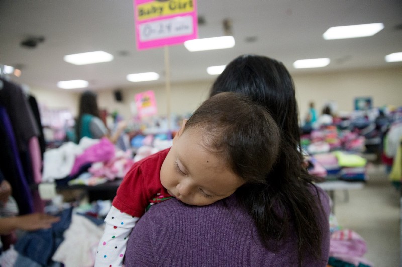 In this April 30, 2105 photo, Gladys Pina, 30, from Honduras holds her 8-month old baby girl at a respite center run by Catholic Charities in McAllen, Texas. She was among nearly two-dozen immigrant mothers who arrived at the center after being released by Border Patrol. CREDIT: AP Photo/Seth Robbins