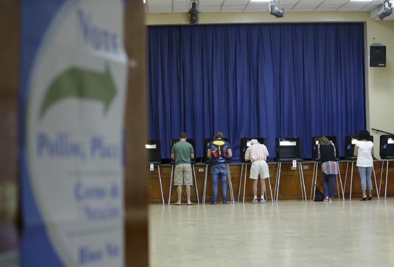 People vote in the general election, Tuesday, Nov. 8, 2016, in Miami Shores, Fla. CREDIT: AP Photo/Lynne Sladky