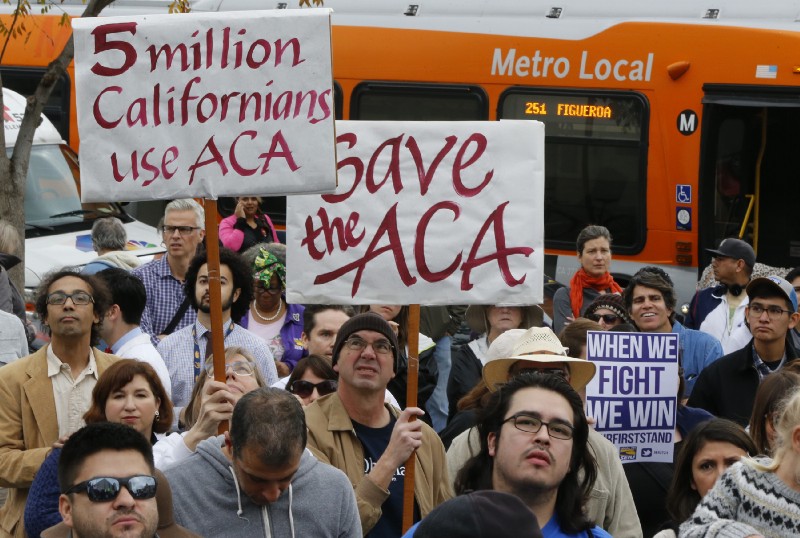 Californians rallied in January to save the Affordable Care Act. CREDIT: AP Photo/Damian Dovarganes