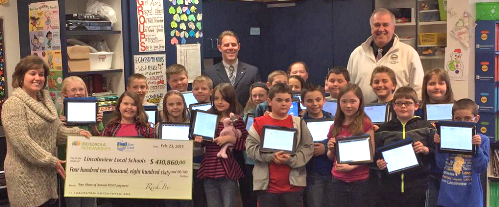 Students at Lincolnview Elementary display their notebook tablets with Senator Cliff Hite. CREDIT: Alexandria Mick