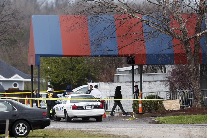 Members of the ATF and local police work at a crime scene at the Cameo club after a fatal shooting, Sunday, March 26, 2017, in Cincinnati CREDIT: AP Photo/John Minchillo