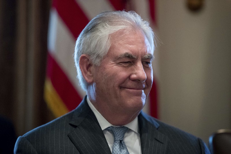 Secretary of State Rex Tillerson smiles as President Donald Trump speaks during a Cabinet meeting in the Cabinet Room of the White House in Washington, Monday, March 13, 2017. CREDIT: AP Photo/Andrew Harnik