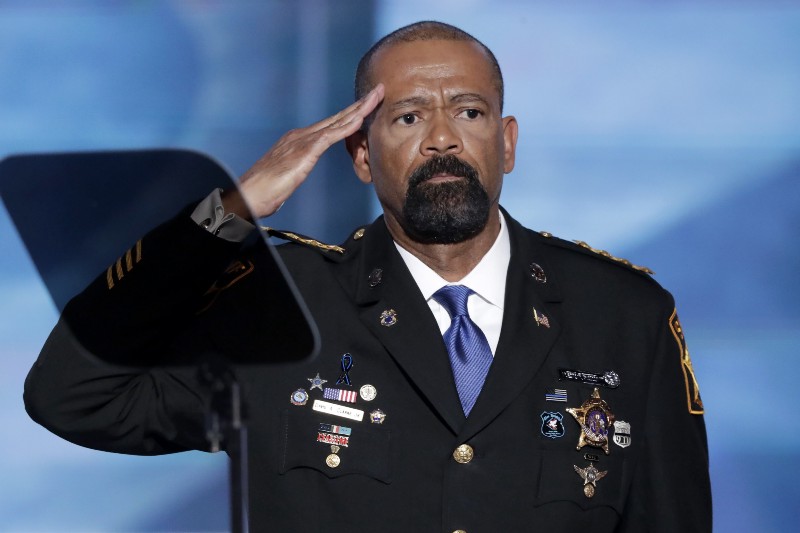 Sheriff David Clarke salutes after speaking during the opening day of the Republican National Convention. CREDIT: AP Photo/J. Scott Applewhite