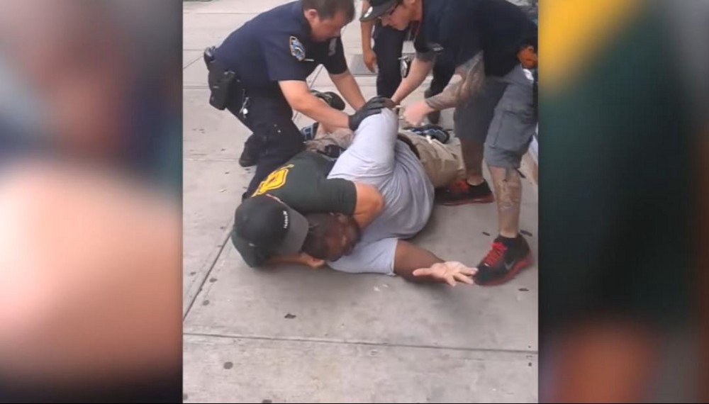 NYPD Officer Daniel Pantaleo holds Eric Garner in a fatal chokehold. CREDIT: YouTube/New York Daily News