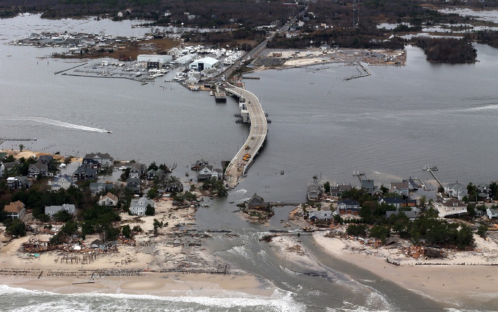 Aerial photo shows storm damage from 2012’s Superstorm Sandy over the Atlantic Coast. CREDIT: AP Photo/Doug Mills, Pool, File
