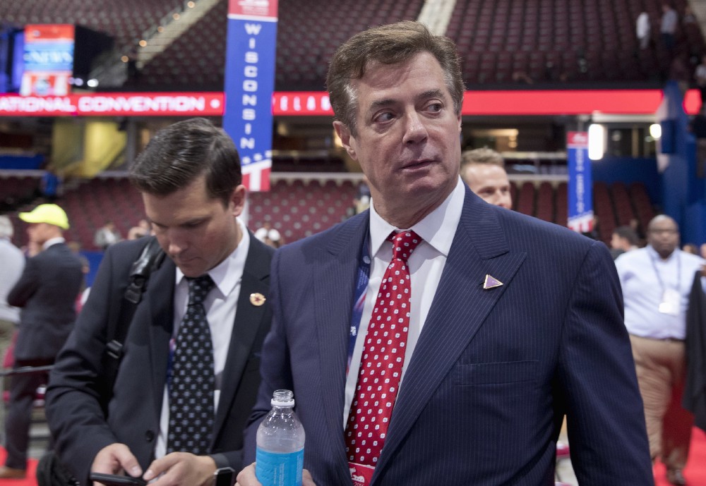 Then-Trump campaign chairman Paul Manafort walks around the convention floor before the opening session of the Republican National Convention in Cleveland last July. Manafort resigned in wake of campaign shakeup and revelations about his work on behalf of a pro-Russian Ukrainian politicians. CREDIT: AP Photo/Carolyn Kaster, File