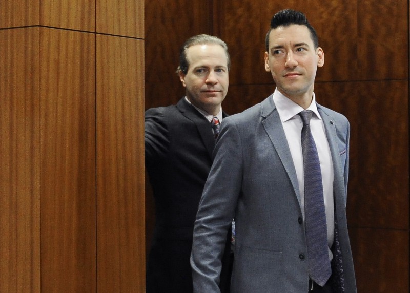 David Robert Daleiden, right, leaves a courtroom after a hearing in Houston. California prosecutors say two anti-abortion activists who made undercover videos of themselves trying to buy fetal tissue from Planned Parenthood have been charged with 15 felony counts of invasion of privacy. CREDIT: AP Photo/Pat Sullivan, File