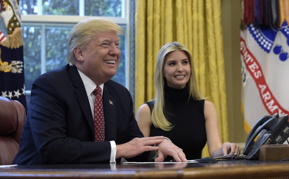 In this April 24, 2017, photo, President Donald Trump, accompanied by his daughter Ivanka Trump, talks via video conference with International Space Station Commander Peggy Whitson from the Oval Office of the White House in Washington. CREDIT: AP Photo/Susan Walsh