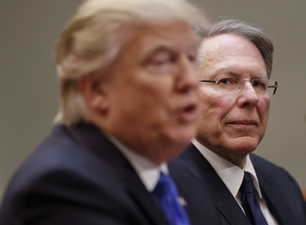 National Rifle Associations (NRA) Executive Vice President and Chief Executive Officer Wayne LaPierre listens at right as President Donald Trump speaks in the Roosevelt Room of the White House in Washington, Wednesday, Feb. 1, 2017. CREDIT: AP Photo/Pablo Martinez Monsivais